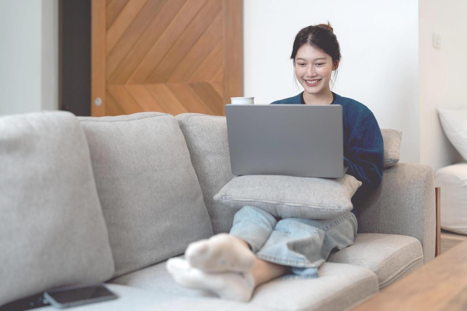 Corporate finance analyst reviewing quarterly reports and forecasting models